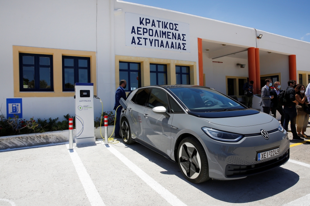 A Volkswagen ID.4 electric car is charged at the premises of the airport on the island of Astypalea, Greece, June 2, 2021. Alexandros Vlachos/Pool via REUTERS
