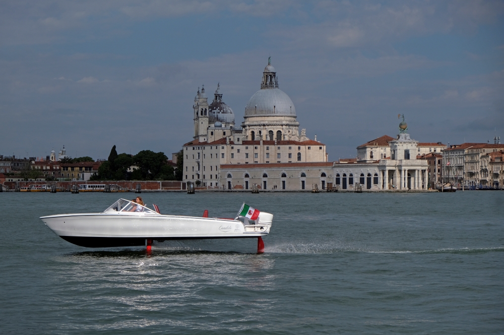 A new Swedish-designed electric boat is tested during the Salone Nautico - Venice Boat Show, in the lagoon city of Venice, Italy June 6, 2021. Picture taken June 6, 2021. REUTERS/Manuel Silvestri