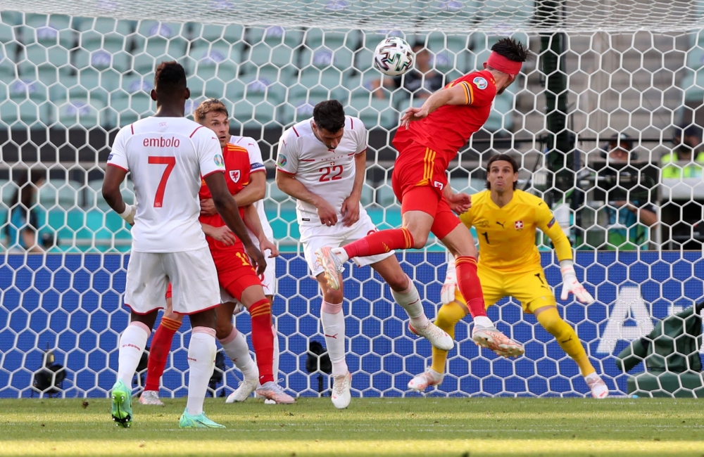 Wales' Kieffer Moore scores their first goal Pool via REUTERS/Tolga Bozoglu