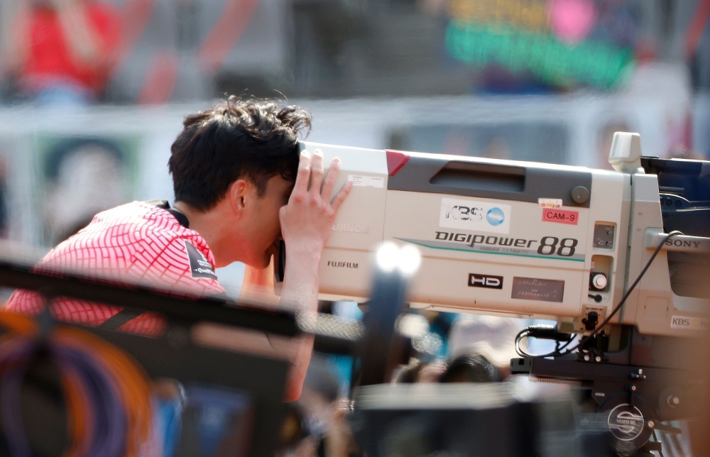 South Korea's Son Heung-Min looks into a TV camera as he celebrates scoring their second goal (REUTERS/Kim Hong-Ji)