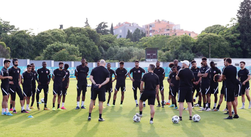 Qatar's players and team officials ahead of a training session in Rovinj, Croatia yesterday.  