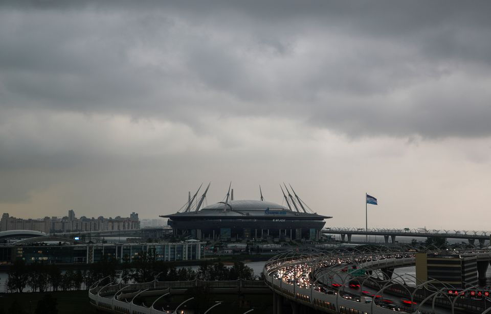 FILE PHOTO: Vehicles drive along a motorway near the Gazprom Arena soccer stadium, one of the host venues for the Euro 2020 tournament, in Saint Petersburg, Russia May 20, 2021. REUTERS/Anton Vaganov/FILE PHOTO