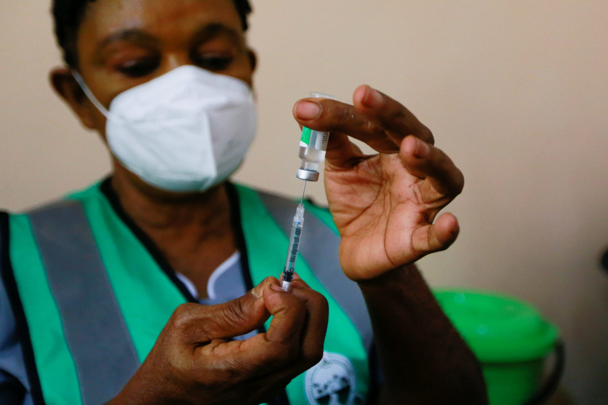FILE PHOTO: healthcare worker prepares a dose of the Oxford/AstraZeneca coronavirus disease (COVID-19) vaccine at the National hospital /FILEPHOTO
