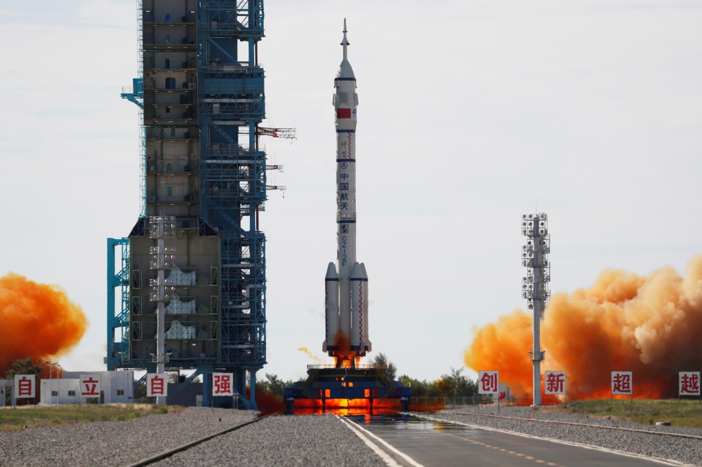 The Long March-2F Y12 rocket, carrying the Shenzhou-12 spacecraft and three astronauts, takes off from Jiuquan Satellite Launch Center for China's first manned mission to build its space station, near Jiuquan, Gansu province, China June 17, 2021. Reuters/