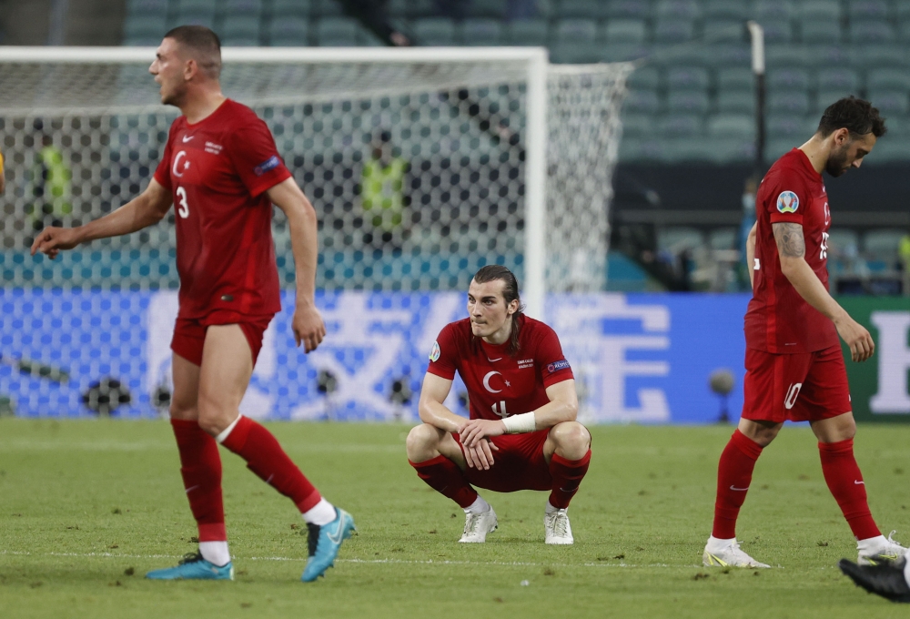 Turkey's Caglar Soyuncu looks dejected after the match Pool via REUTERS/Valentyn Ogirenko