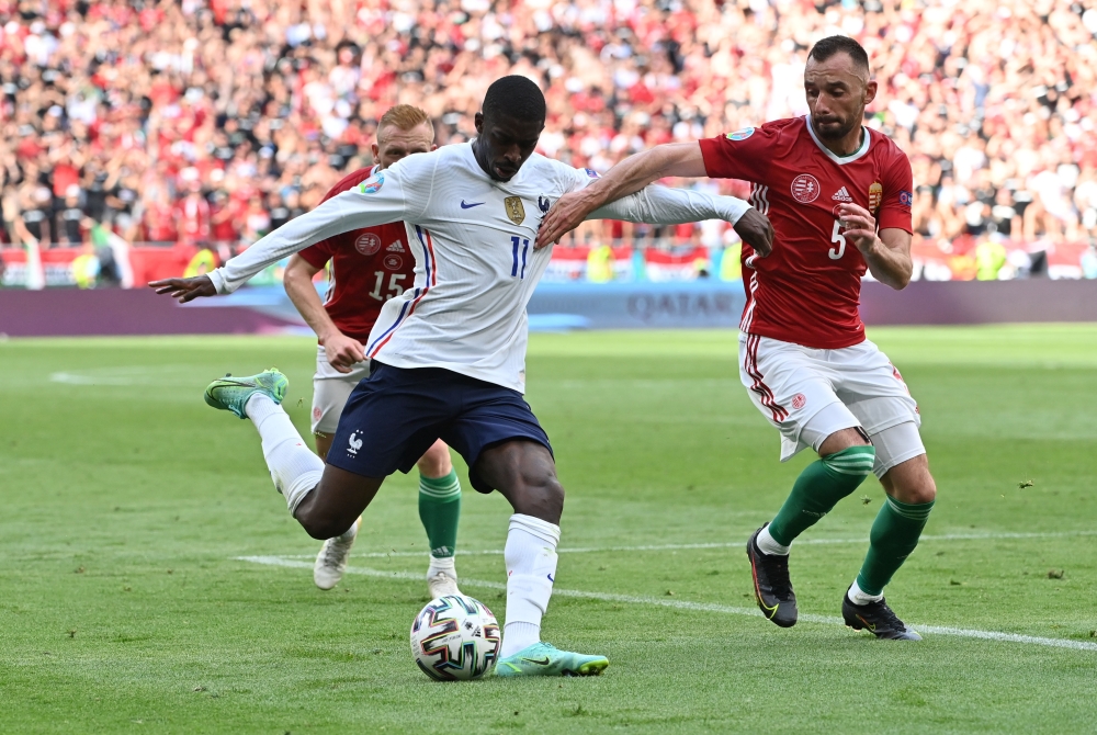 France's Ousmane Dembele in action with Hungary's Attila Fiola Pool via Reuters/Tibor Illyes
 