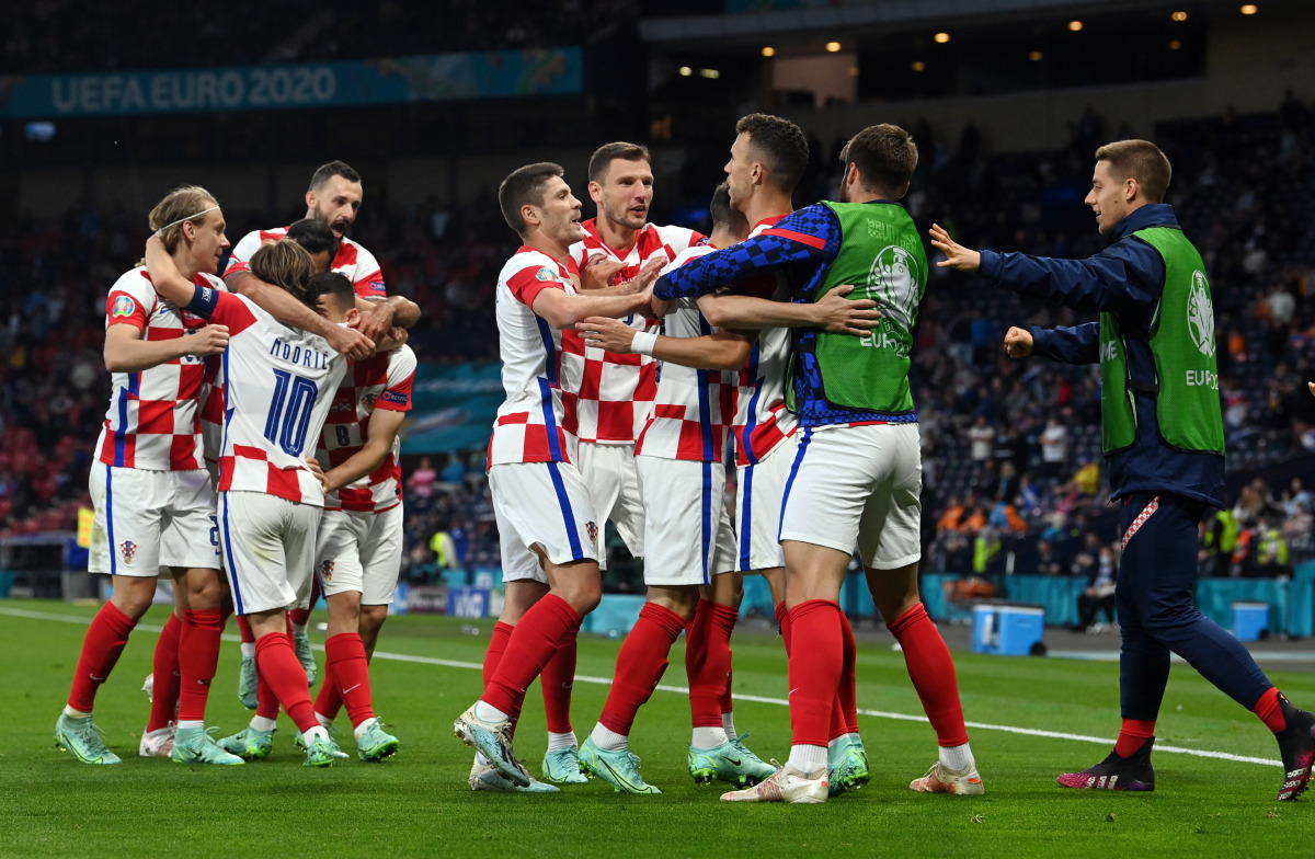 Soccer Football - Euro 2020 - Group D - Croatia v Scotland - Hampden Park, Glasgow, Scotland, Britain - June 22, 2021 Croatia's Ivan Perisic celebrates scoring their third goal with teammates Pool via REUTERS/Paul Ellis

