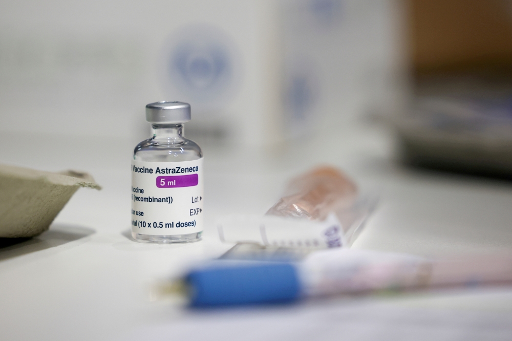 A vial of AstraZeneca coronavirus vaccine is seen at a vaccination centre in Westfield Stratford City shopping centre, amid the outbreak of coronavirus disease (COVID-19), in London, Britain, February 18, 2021. REUTERS/Henry Nicholls//File Photo