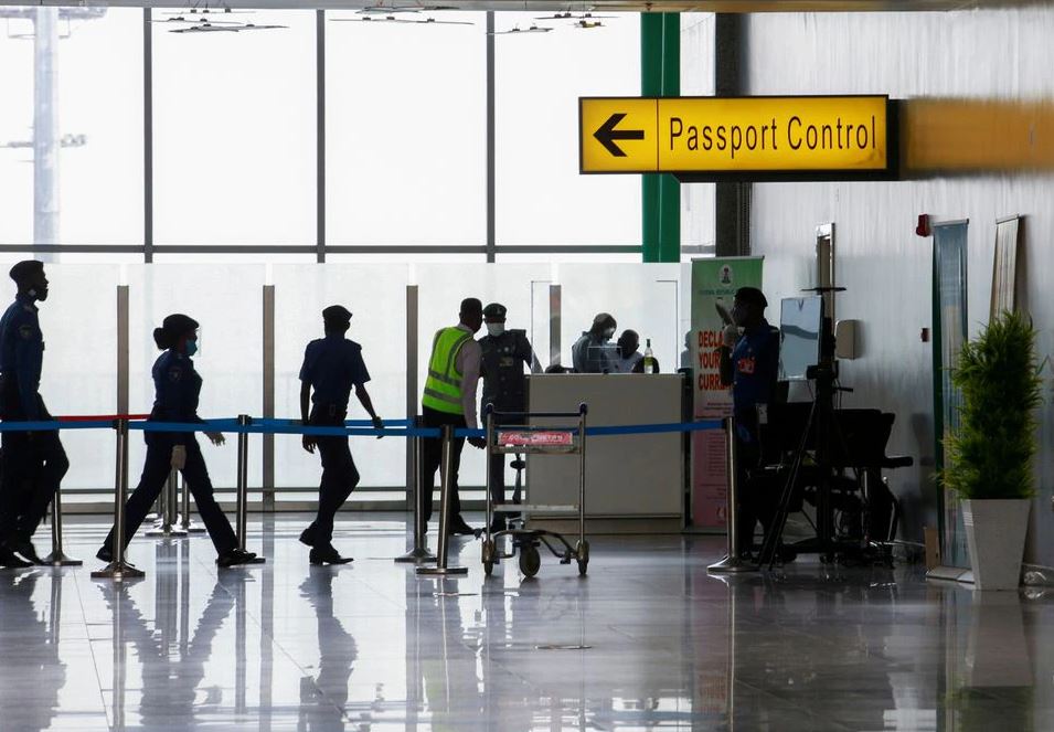 Security officers are seen at the passport control point at the Nnamdi Azikiwe international airport in Abuja, Nigeria September 7, 2020. REUTERS/Afolabi Sotunde/File Photo

