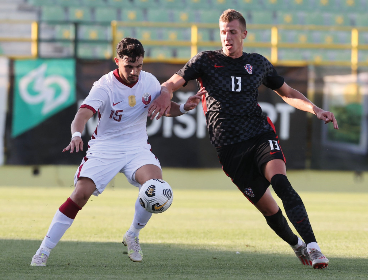Qatar’s Bassem Al Rawi (left) in action yesterday. 