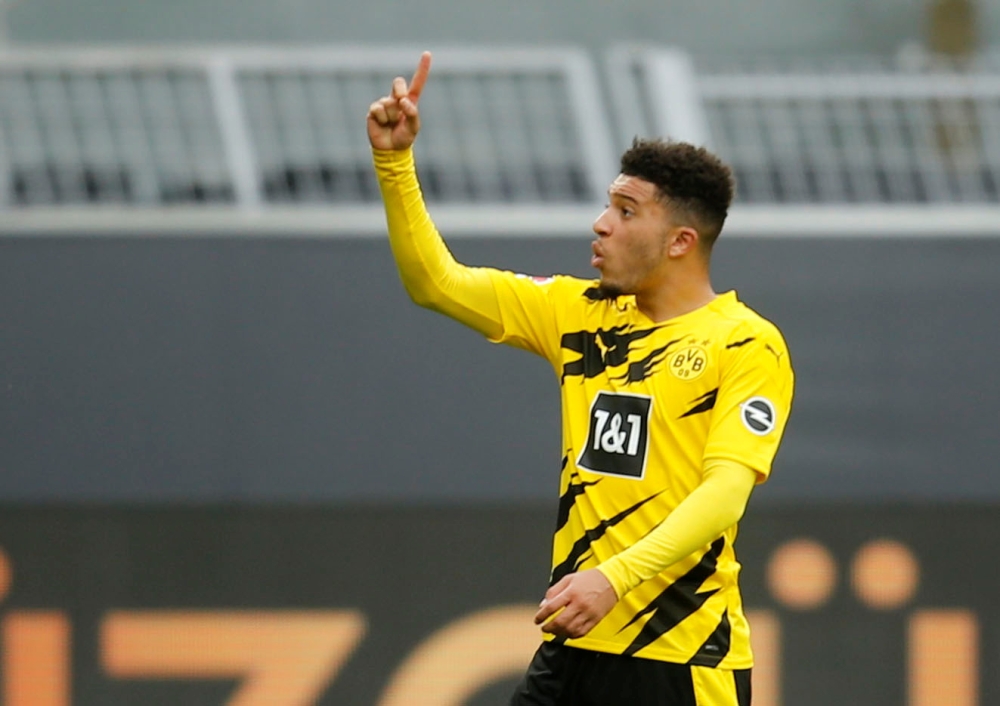 Borussia Dortmund's Jadon Sancho celebrates after the match Pool via REUTERS/Leon Kuegeler
