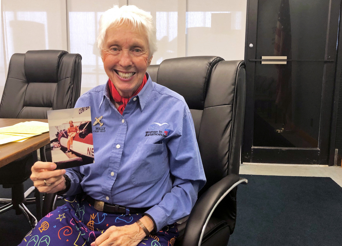 FILE PHOTO: Wally Funk, a Virgin Galactic ticketholder and one of the First Lady Astronaut Trainees or ‘Mercury 13’ women, is pictured holding a photo of herself at the International Women’s Air and Space Museum in Cleveland, Ohio, U.S. March 29, 2019. RE