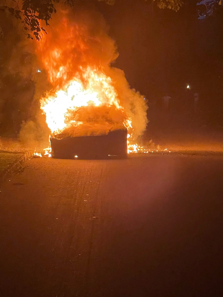 Tesla Inc's new Model S Plaid electric car is seen in flames in Pennsylvania, U.S., in this handout photo provided to Reuters on July 2, 2021. According to an attorney for the driver, the car went into flames while the owner was driving it on Tuesday, thr