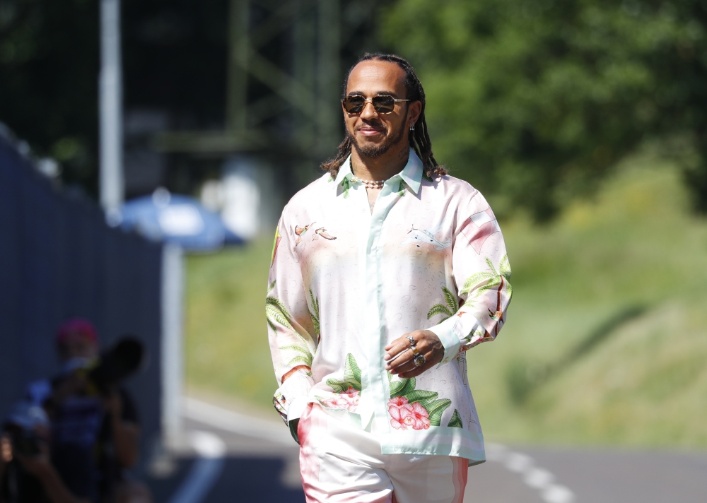 Mercedes' Lewis Hamilton arrives at the circuit ahead of practice. (Reuters/Leonhard Foeger)