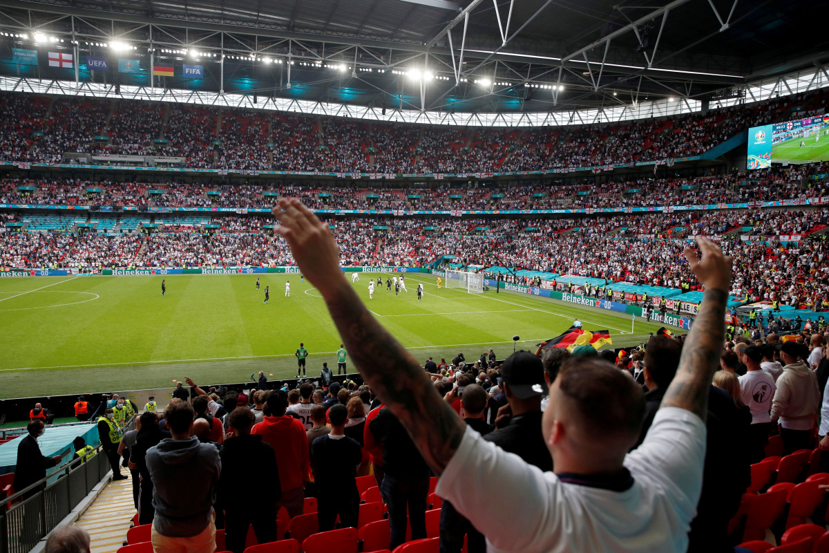 FILE PHOTO: Wembley Stadium, London, Britain - June 29, 2021 England fan celebrates during the match Pool via REUTERS/Matthew Childs/File Photo
