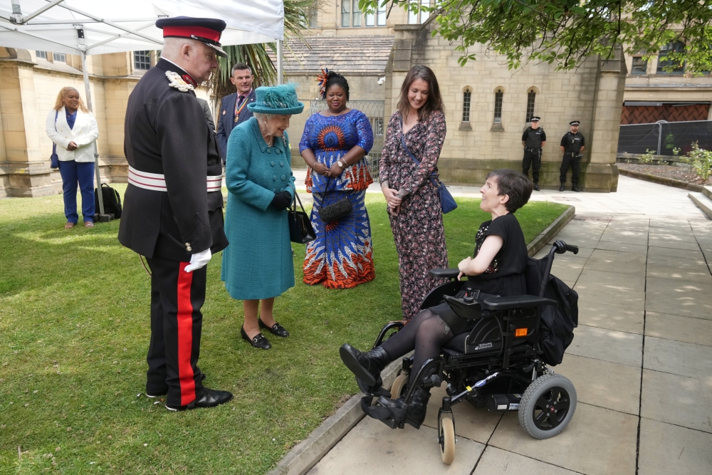 Britain's Queen Elizabeth meets guests during a visit to Manchester Cathedral, in Manchester, Britain, July 8, 2021. (Reuters)