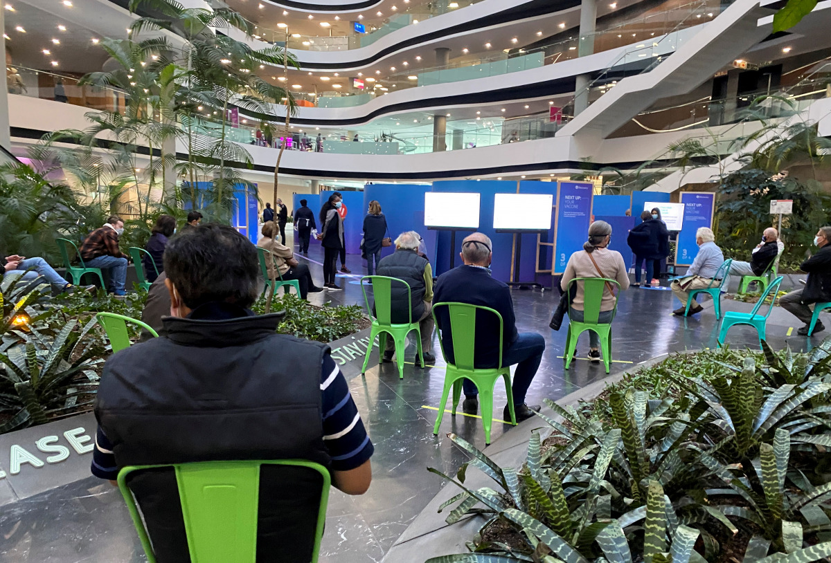 People queue to receive coronavirus disease (COVID-19) vaccinations in Sandton, Johannesburg, South Africa, July 5, 2021. REUTERS/Marius Bosch
