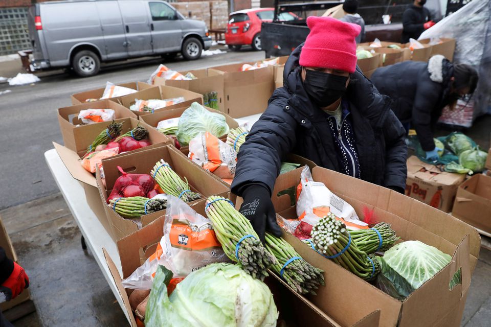Food boxes are packed at the nonprofit New Life Centers' food pantry in Chicago, Illinois, U.S. March 16, 2021. REUTERS/Daniel Acker/File Photo

