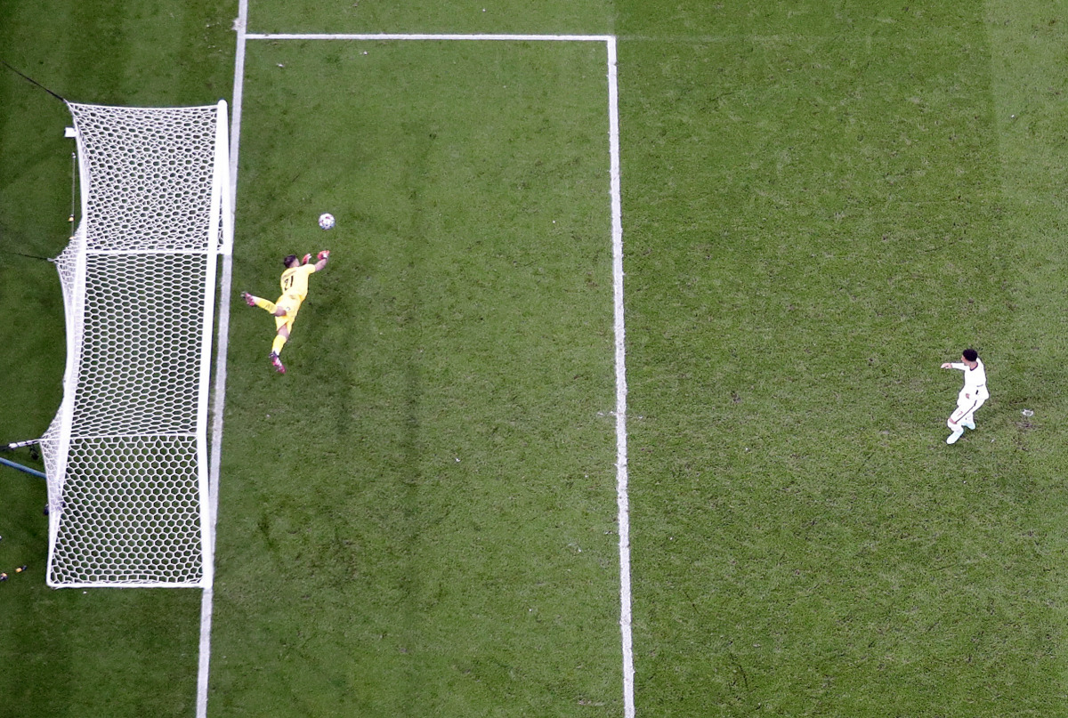 Soccer Football - Euro 2020 - Final - Italy v England - Wembley Stadium, London, Britain - July 11, 2021 Italy's Gianluigi Donnarumma saves a penalty from England's Jadon Sancho during a penalty shootout REUTERS/Carl Recine

