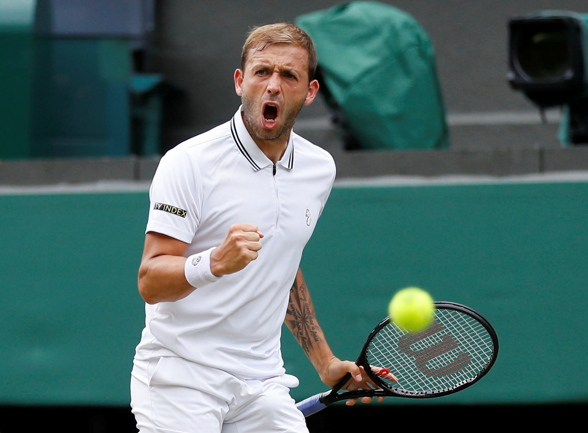 FILE PHOTO: Tennis - Wimbledon - All England Lawn Tennis and Croquet Club, London, Britain - July 2, 2021 Great Britain's Dan Evans reacts during his third round match against Sebastian Korda of the U.S. REUTERS/Peter Nicholls/File Photo
