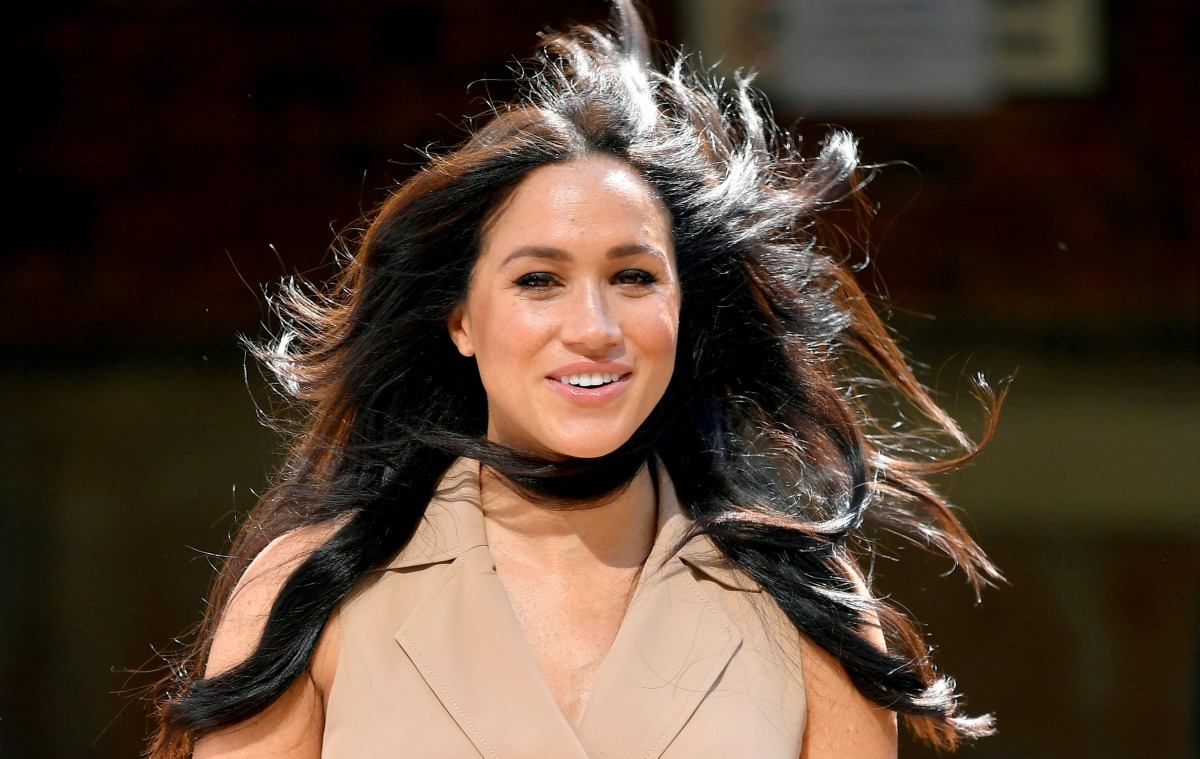 FILE PHOTO: Britain's Meghan Markle, Duchess of Sussex, arrives to meet academics and students during a roundtable discussion on female access to higher education with the Association of Commonwealth Universities, at the University of Johannesburg, Johann