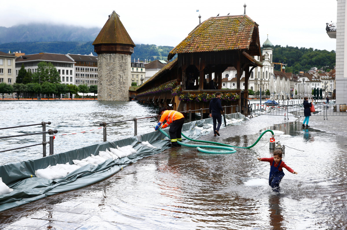 A mobile flood barrier is seen along the Reuss River in front of the Kapellbruecke bridge in Luzern, Switzerland July 15, 2021. REUTERS/Arnd Wiegmann

