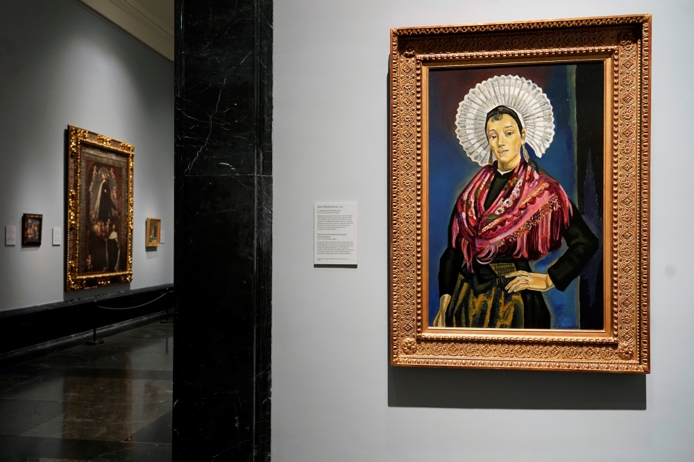 The portrait called La Bolonesa (The Bolognese) painted by Maria Blanchard is seen at El Prado Museum in Madrid, Spain July 21, 2021. Picture taken July 21, 2021. REUTERS/Juan Medina