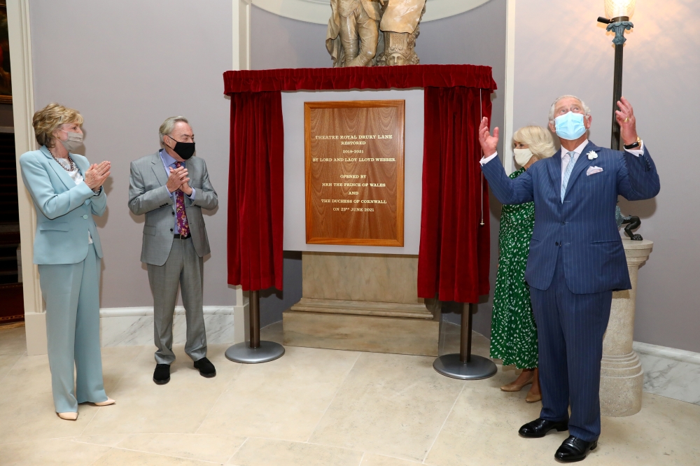 Britain's Prince Charles and Camilla, Duchess of Cornwall, stand next to Lord Andrew Lloyd Webber and Lady Madeleine Lloyd Webber as they unveil a plaque to commemorate their visit to Theatre Royal in London, Britain June 23, 2021. Tim P. Whitby/Pool via 