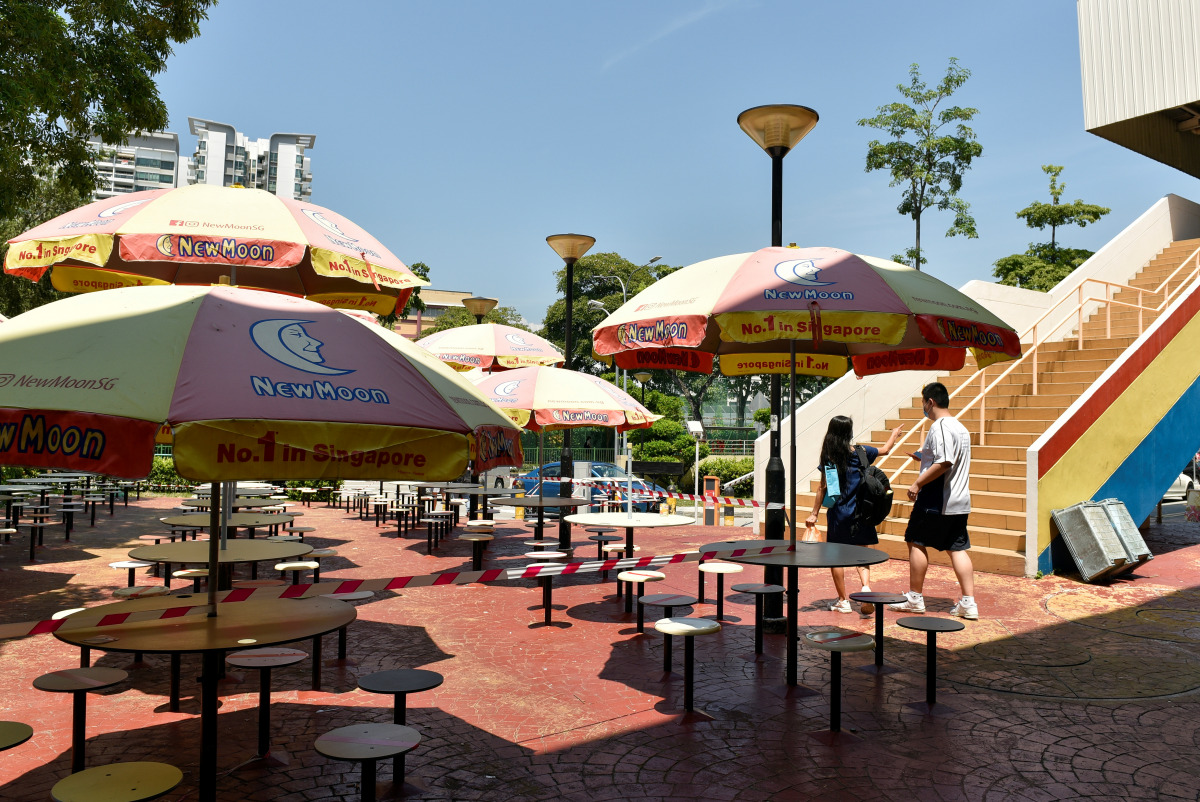The seating area at a food centre is cordoned off to restrict dining-in as part of the latest measures to curb the coronavirus disease (COVID-19) outbreak in Singapore July 23, 2021. REUTERS/Caroline Chia
