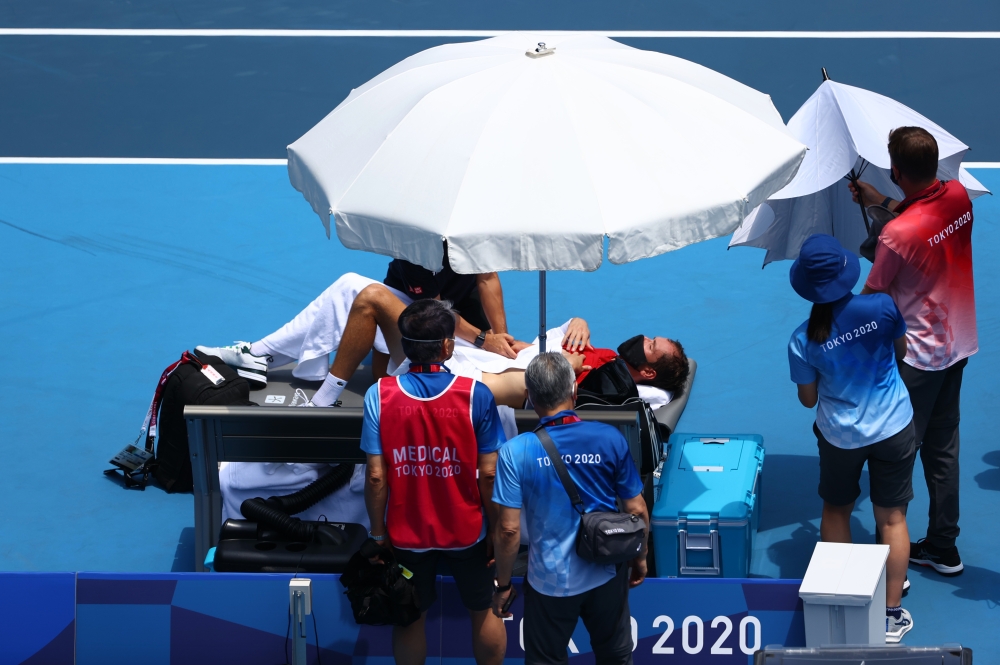 Daniil Medvedev of the Russian Olympic Committee takes a medical timeout during his third round match against Fabio Fognini of Italy Reuters/Mike Segar