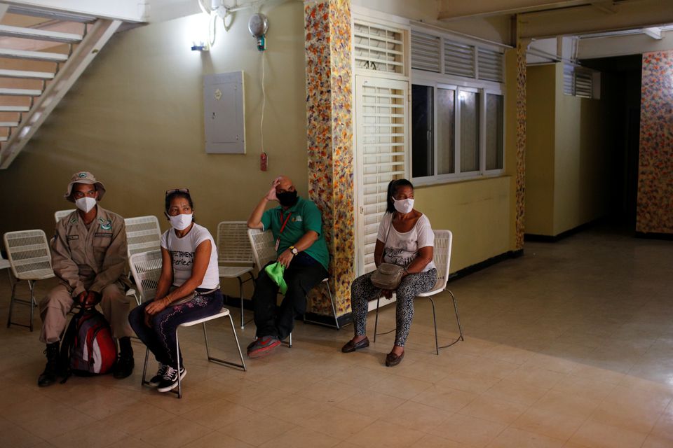 People wait to receive a dose of Cuba's Abdala vaccine at a vaccination center in Caracas, Venezuela July 1, 2021. REUTERS/Manaure Quintero

