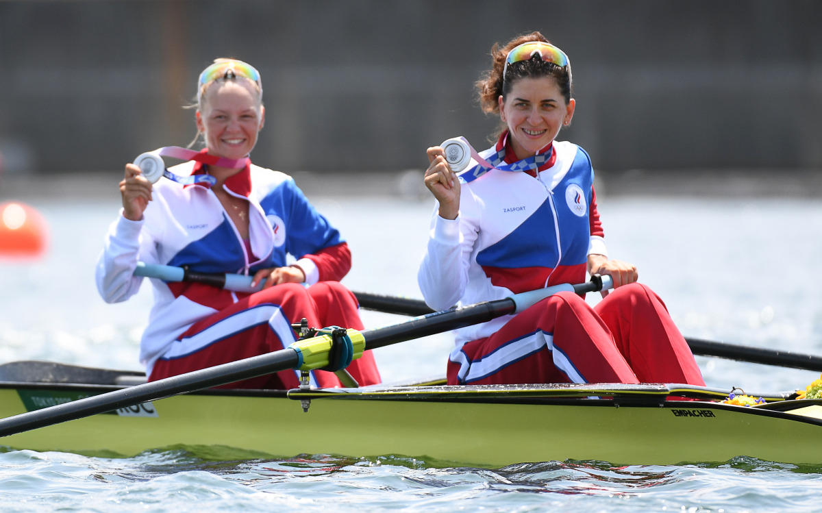 Tokyo 2020 Olympics - Rowing - Women's Pair - Medal Ceremony - Sea Forest Waterway, Tokyo, Japan - July 29, 2021 Silver medallists Vasilisa Stepanova of the Russian Olympic Committee and Elena Oryabinskaya of the Russian Olympic Committee celebrate in the