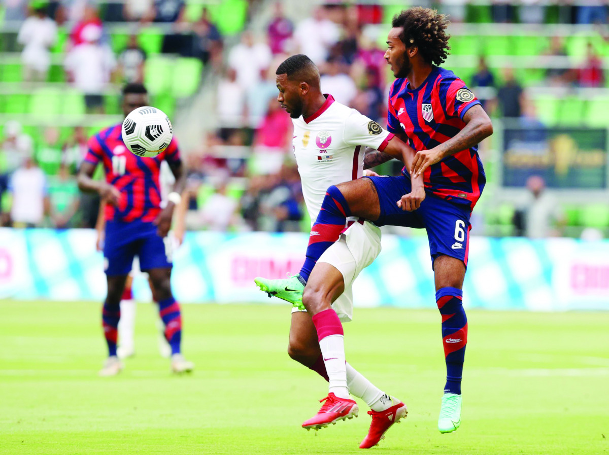 Action during the Concacaf Gold Cup semi-final between Qatar and USA yesterday.