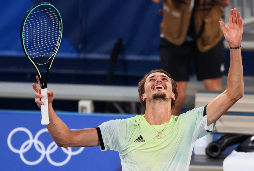 Alexander Zverev of Germany celebrates after winning his gold medal match against Karen Khachanov of the Russian Olympic Committee REUTERS/Stoyan Nenov