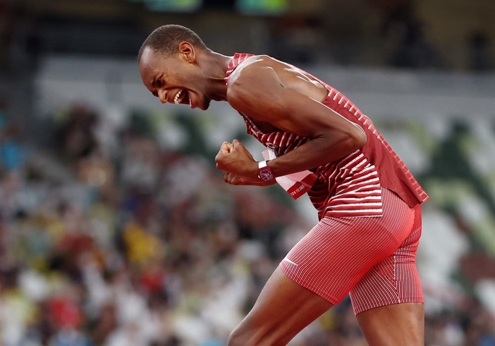 Mutaz Essa Barshim of Qatar celebrates after his jump REUTERS/Kai Pfaffenbach