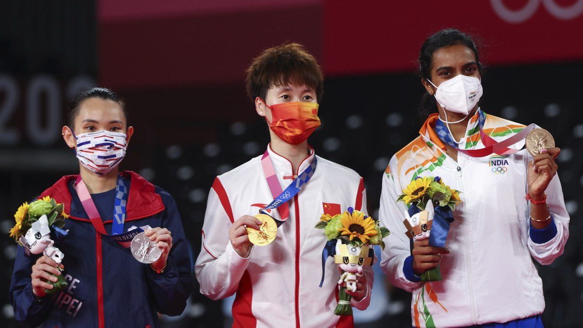 Tokyo 2020 Olympics - Badminton - Women's Singles - Medal Ceremony - MFS - Musashino Forest Sport Plaza, Tokyo, Japan - August 1, 2021. Gold medallist Chen Yufei of China, silver medallist Tai Tzu-Ying of Taiwan and bronze medallist P.V. Sindhu of India p