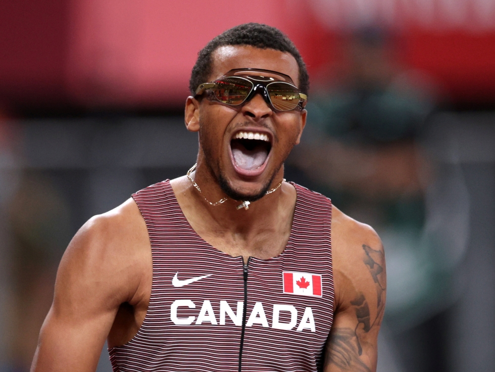 Andre De Grasse of Canada celebrates after winning gold REUTERS/Hannah Mckay