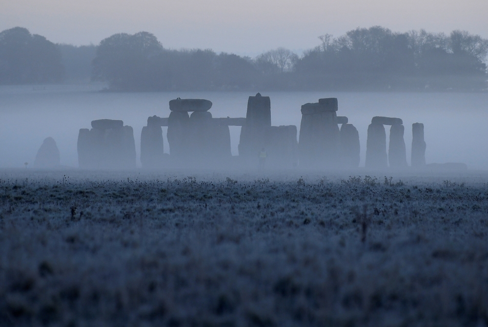 Stonehenge ancient stone circle is seen at dawn, near Amesbury, Wiltshire, Britain, November 4, 2020. REUTERS/Toby Melville/File Photo
