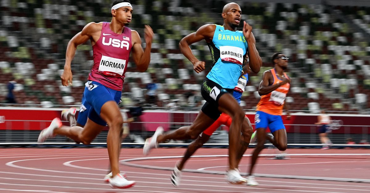 Tokyo 2020 Olympics - Athletics - Men's 400m - Final - Olympic Stadium, Tokyo, Japan - August 5, 2021. Steven Gardiner of the Bahamas in action on his way to winning gold alongside Michael Norman of the United States REUTERS/Dylan Martinez

