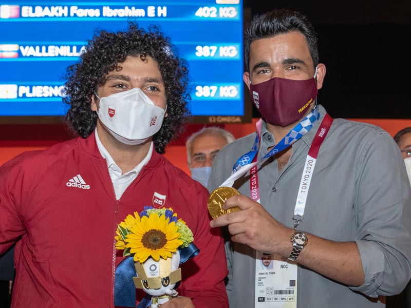Qatar Olympic Committee President Sheikh Joaan bin Hamad Al Thani, poses for a photograph with Fares Ibrahim after the Qatari weightlifter won the country's first ever Olympic gold medal on Saturday.