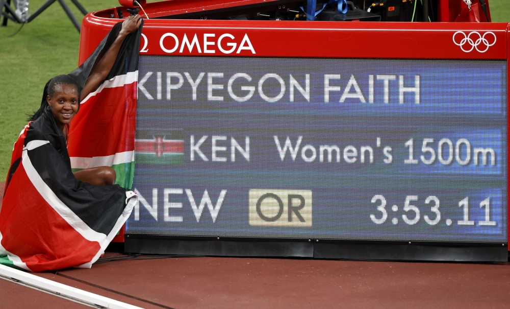 Faith Kipyegon of Kenya celebrates winning the gold medal and breaking the Olympic record REUTERS/Phil Noble