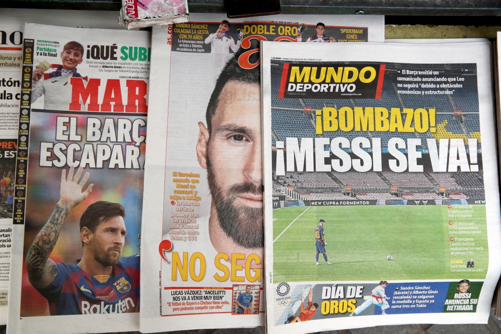 Newspapers are seen displaying front page images of Barcelona's Lionel Messi at a newspaper selling stall outside the Camp Nou. (REUTERS/File Photo)