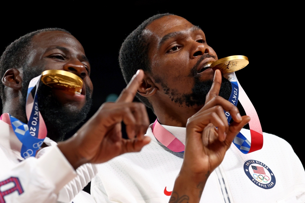  Kevin Durant of the United States and Draymond Green of the United States pose with their gold medals at the podium Reuters/Brian Snyder