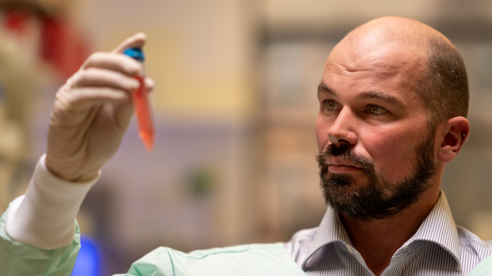 Professor David Nisbet from Australian National University (ANU) holds a vial as researchers from ANU developed a new type of hydrogel that could help to defeat Parkinson's disease, in this undated handout picture. AUSTRALIAN NATIONAL UNIVERSITY/Jamie Kid
