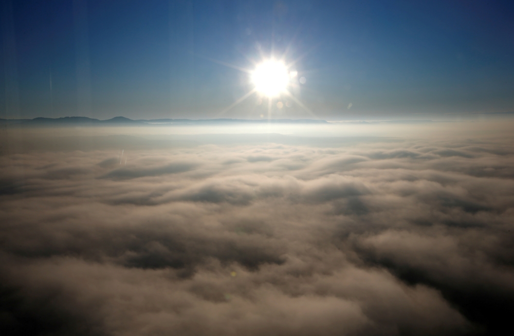 A sunrise is seen from Thyssenkrupp's test tower in Rottweil, Germany, January 21, 2020. REUTERS/Michaela Rehle/File Photo