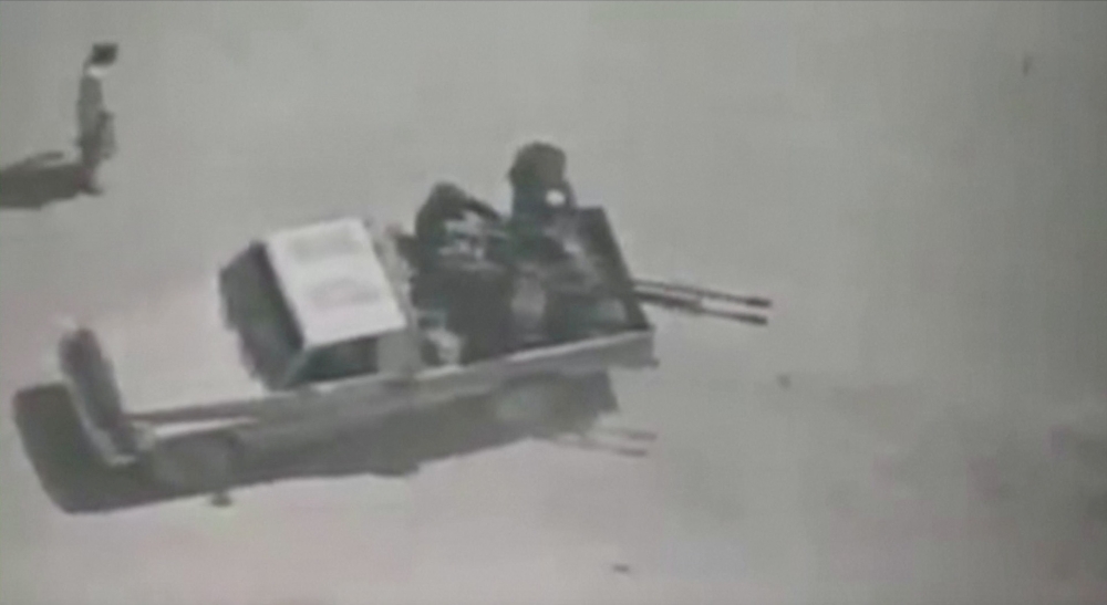 People believed to be militants are seen on a pickup truck with a gun in Afghanistan, in this still image obtained from a video posted by the Afghan Defence Ministry on its Facebook page. Reuters could not independently verify the locations nor the date o