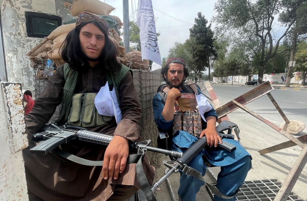 Members of Taliban forces sit at a checkpost in Kabul, Afghanistan August 17, 2021. REUTERS