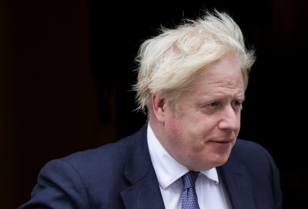 Britain's Prime Minister Boris Johnson walks outside Downing Street in London, Britain, August 18, 2021. REUTERS/Hannah McKay
