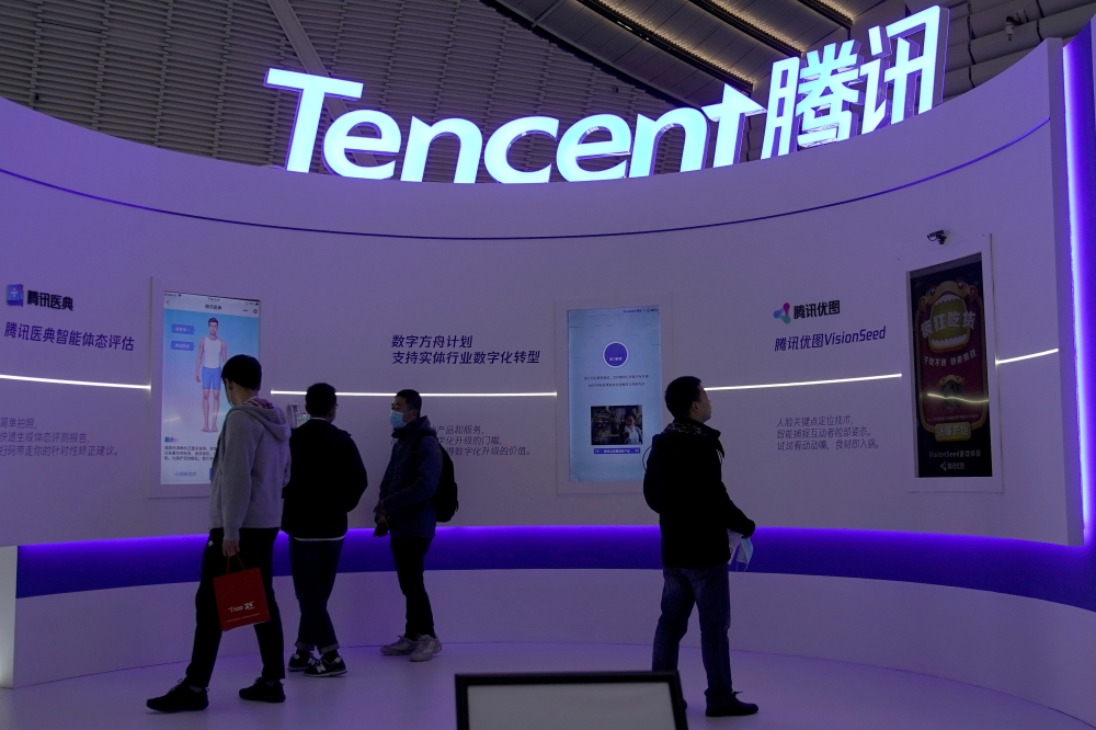 FILE PHOTO: A logo of Tencent is seen during the World Internet Conference (WIC) in Wuzhen, Zhejiang province, China, November 23, 2020. REUTERS/Aly Song