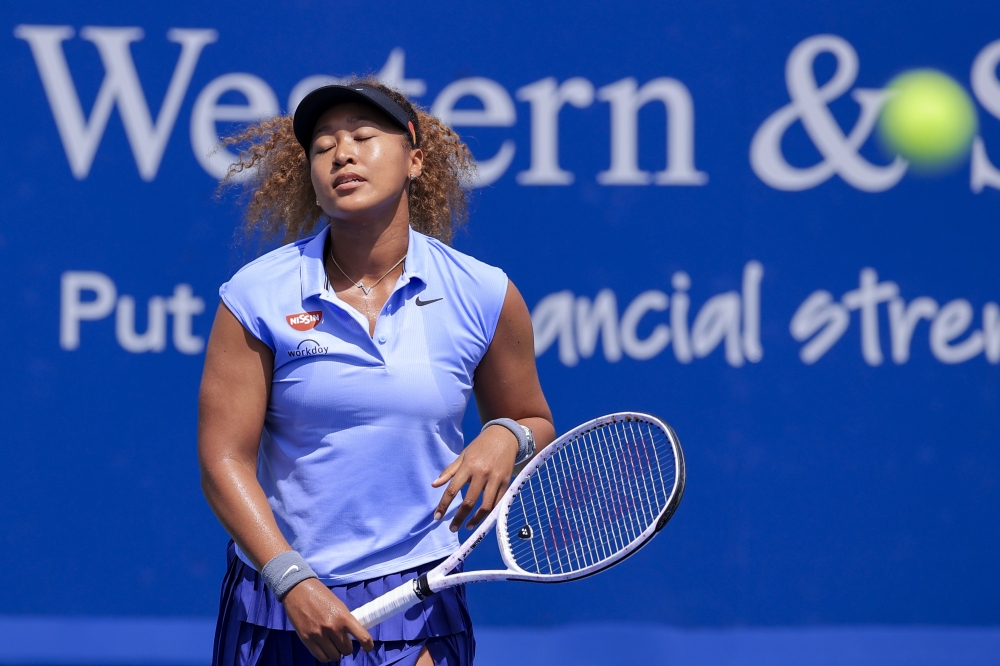 Naomi Osaka (JPN) reacts after returning a shot against Cori Gauff (USA) during the Western and Southern Open tennis tournament at Lindner Family Tennis Center. Mandatory Credit: Aaron Doster-USA TODAY Sports